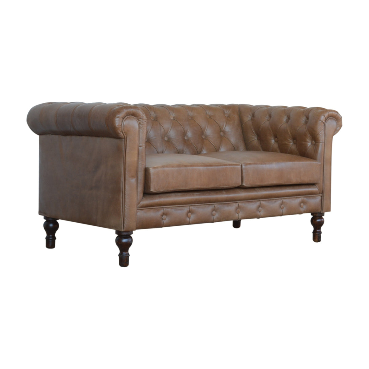 Deep button tufting on the buffalo leather Chesterfield sofa