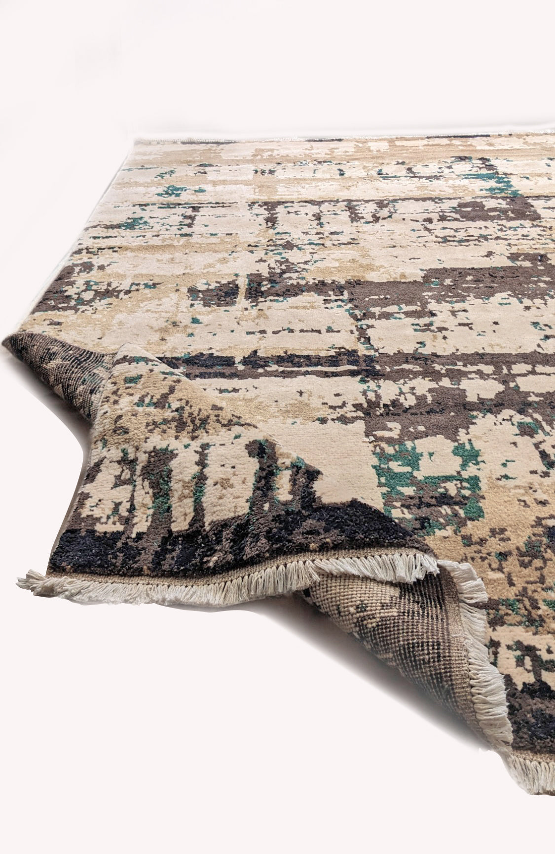 Hand-knotted wool texture on the brown Giro rug