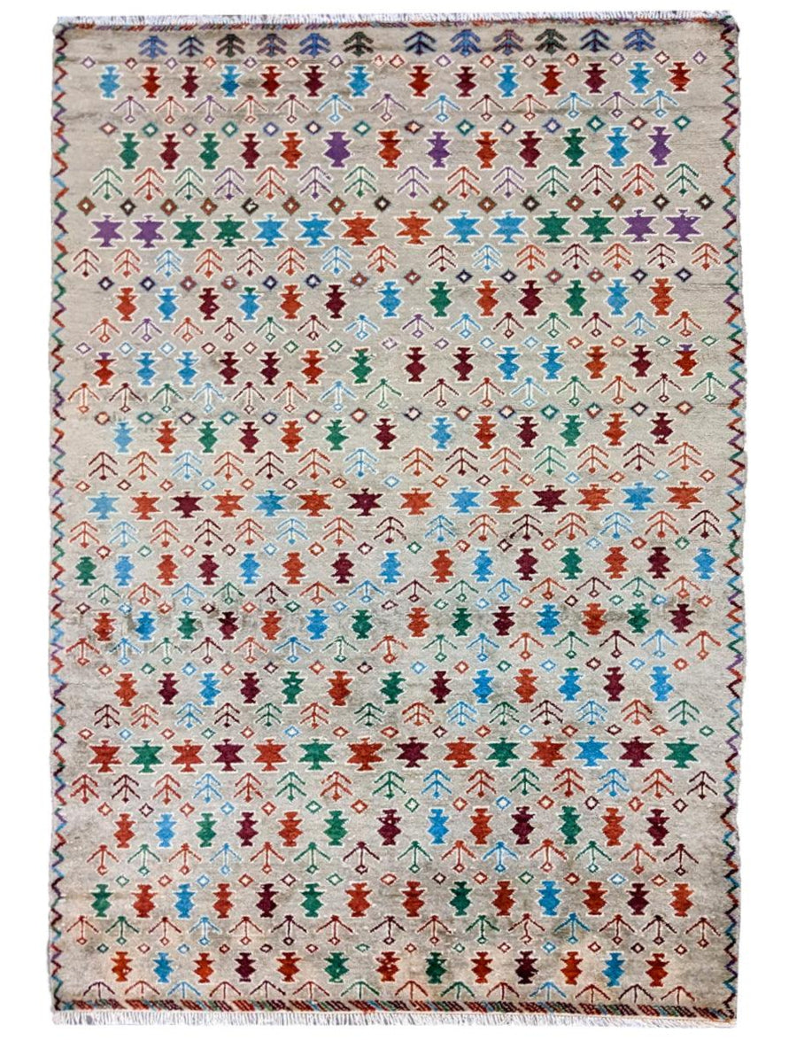 Tangerine hand-knotted wool rug with geometric Ikat pattern